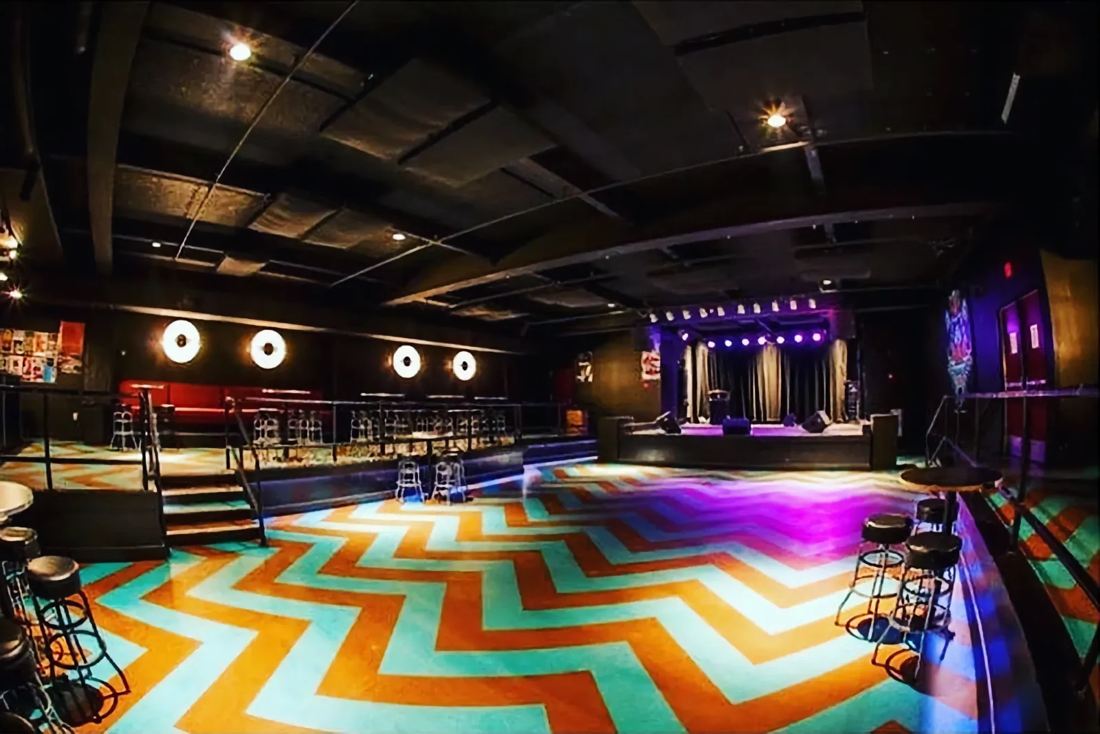 The Pyramid Scheme venue room with lights and stage.
